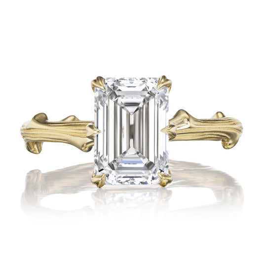 ::color_yellow ::| 2.8ct emerald cut lab-grown diamond solitaire engagement ring with a twig band yellow gold front view