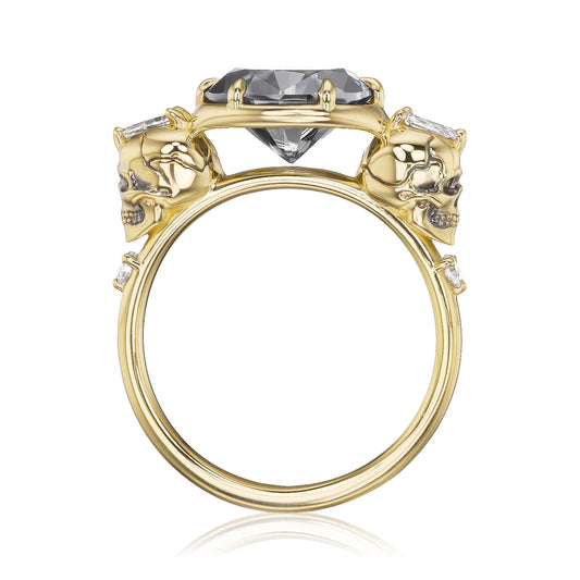 ::color_yellow ::| 2.65ctw oval grey moissanite engagement ring Juliet Skull memento mori yellow gold diamond accents standind side view
