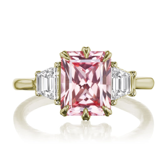 ::color_yellow ::| 3.4ctw radiant cut peach sapphire three stone engagement ring Cora yellow gold trapezoid diamonds front view