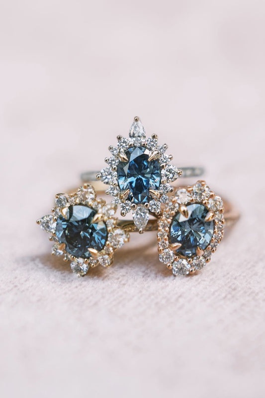 Everlum blue lab-grown diamond halo engagement rings, oval and round cut
