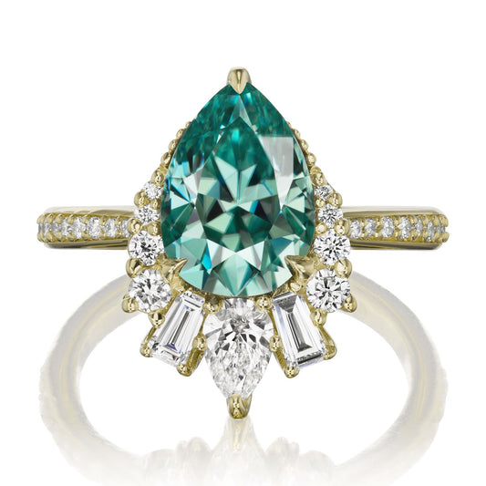::color_yellow ::shank_halfway_three-quarters ::shank_three-quarters_halfway_no ::| 2.53ctw+ pear aqua-teal moissanite engagement ring with diamond accents Artemis yellow gold diamond shank front view