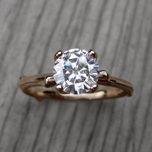 1ct rose gold twig solitaire engagement ring with a Forever One Hearts & Arrows moissanite