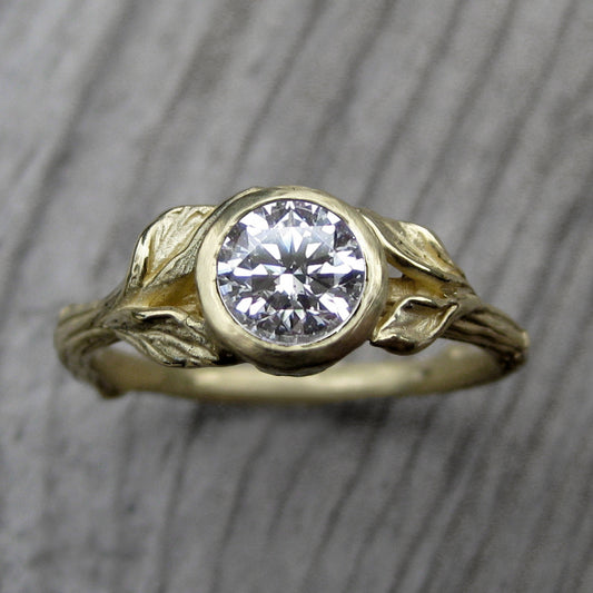 1ct yellow gold twig and leaf bezel engagement ring with a Forever One moissanite