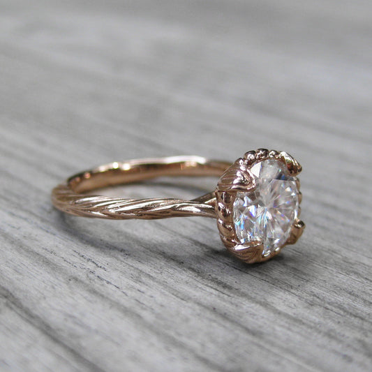 Side View of 1.5ct Forever One Moissanite Rose gold solitaire engagement ring