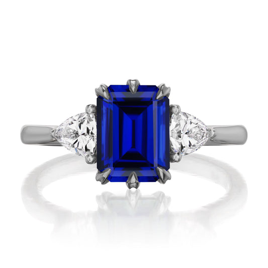 ::color_white ::| 2.52ctw emerald cut blue sapphire three stone engagement ring Juno white gold trillion diamonds front view