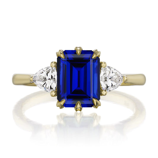::color_yellow ::| 2.52ctw emerald cut blue sapphire three stone engagement ring Juno yelllow gold trillion diamonds front view