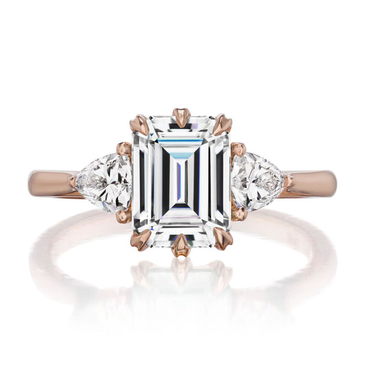 ::color_rose ::| 2.17ctw emerald cut moissanite three stone engagement ring Avery rose gold trillion diamonds front view