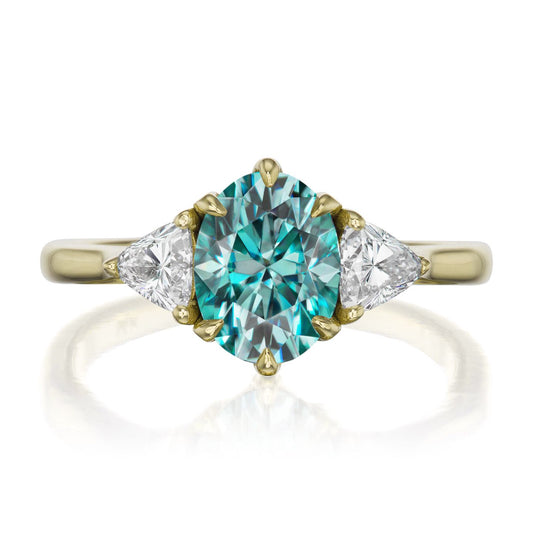 ::color_yellow ::| 1.92ctw oval aqua-teal moissanite three stone engagement ring Juno yellow gold trillion diamonds front view