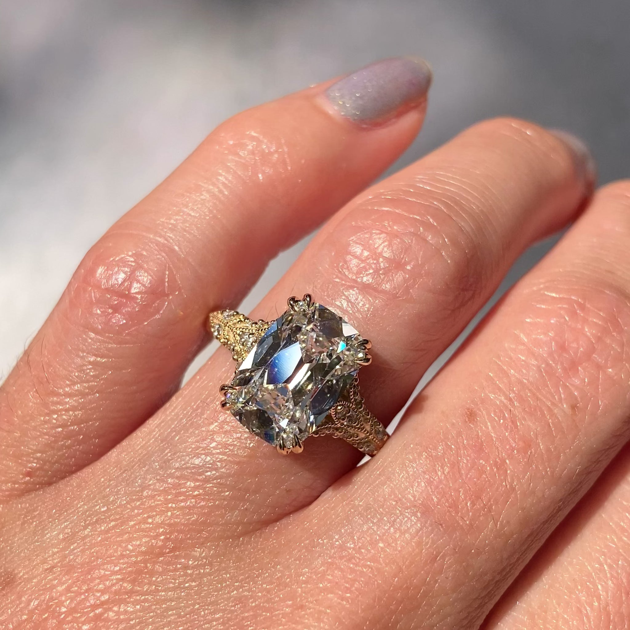 ::color_yellow ::| Florence Edwardian styled 4ct old mine cut lab-grown cushion diamond engagement ring with milgrain and diamond accents in yellow gold modeled on finger video