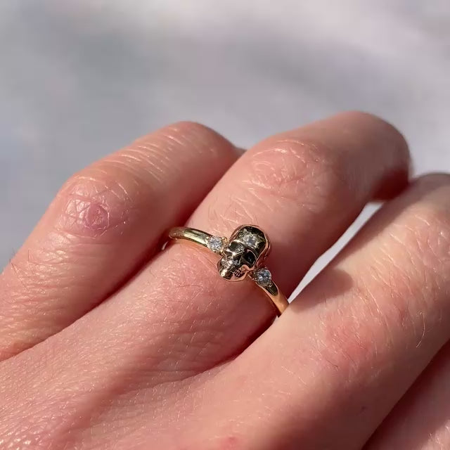 ::color_yellow ::|Persephone memento mori yellow gold skull ring with accent gems worn on finger video