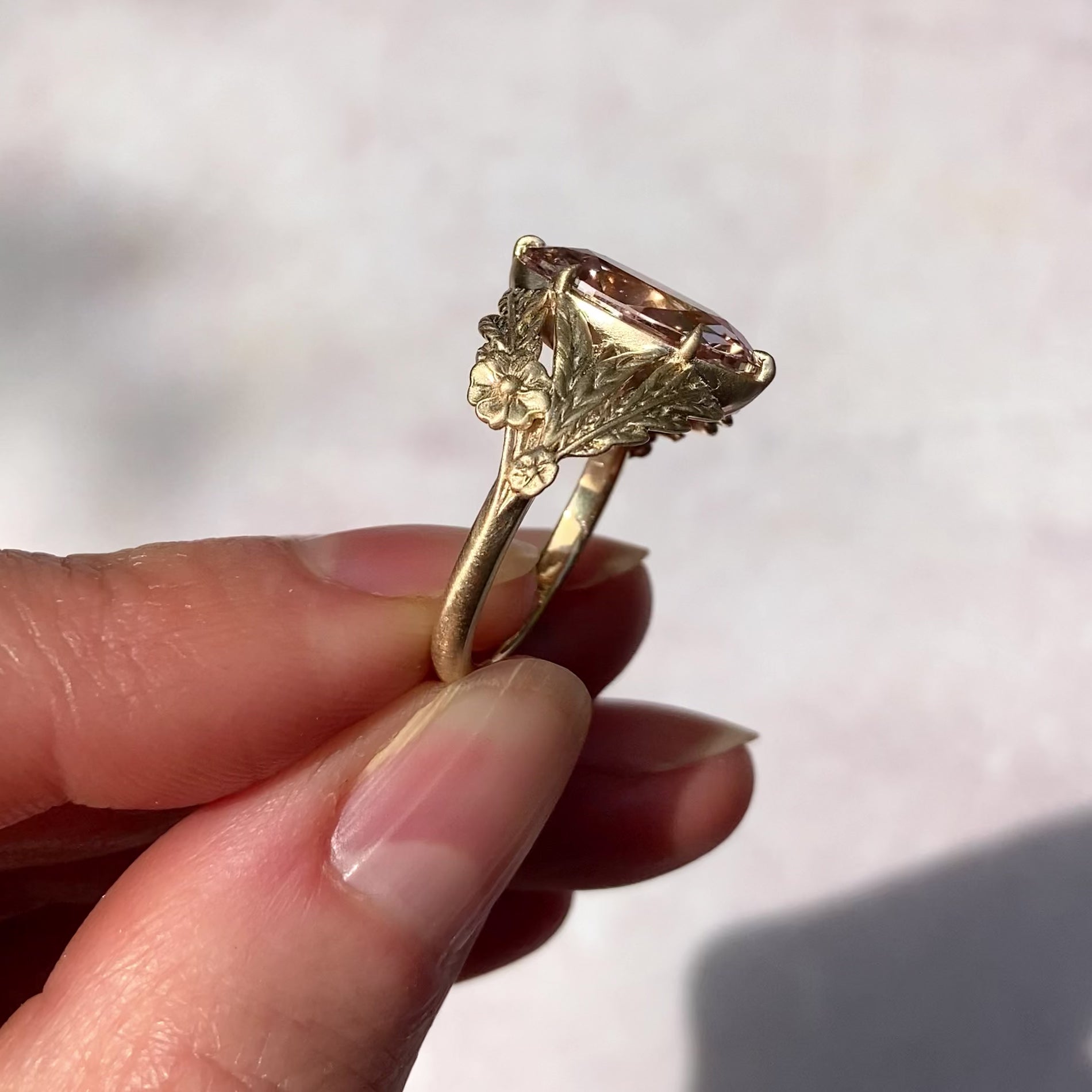 ::color_yellow ::| 3.05ct champagne moval lab diamond framed by a tangle of leaves, ferns, and forget me not flowers yellow gold video