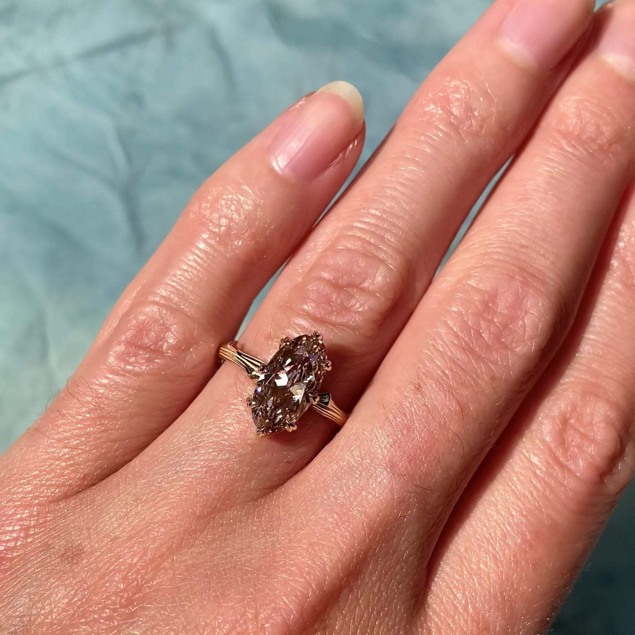 ::color_yellow ::| 2ct oval moval lab-grown diamond solitaire engagement ring with a twig band yellow gold modeled on finger video