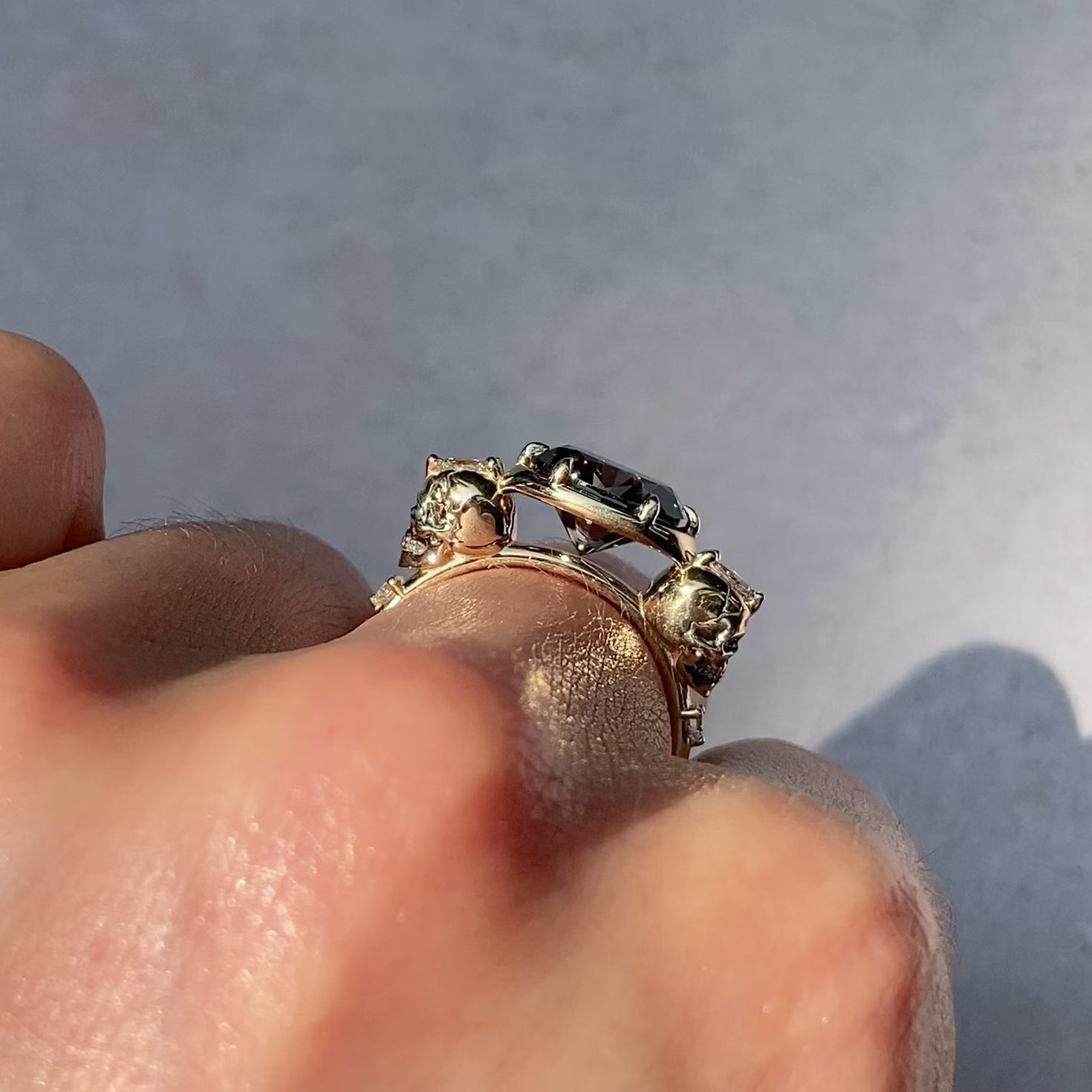 ::color_yellow ::| 2.65ctw oval grey moissanite engagement ring Juliet Skull memento mori yellow gold diamond accents worn on finger video