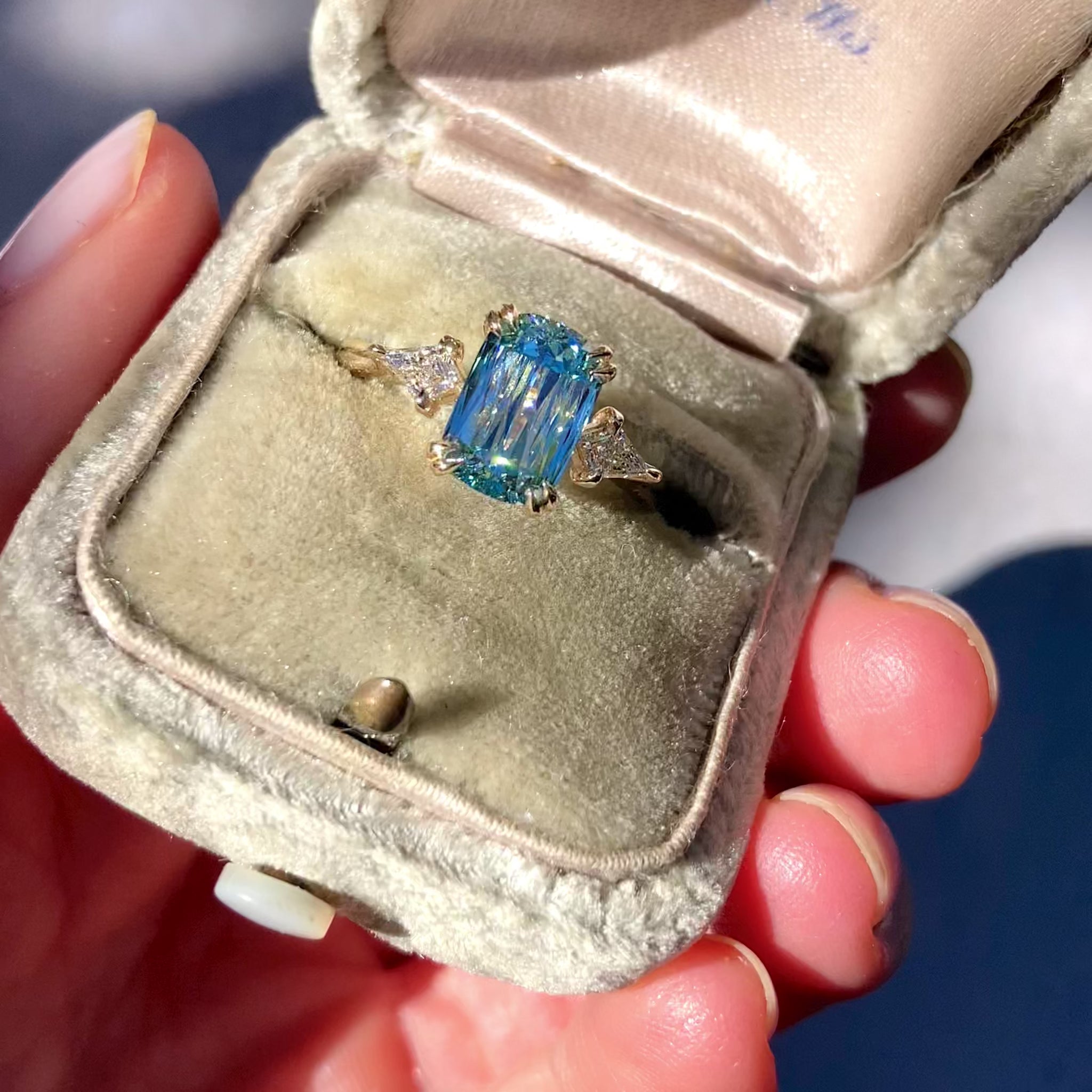 ::color_yellow ::| Raven 2ct scissor cut elongated cushion lab-grown blue diamond solitaire engagement ring with kite accent diamonds in yellow gold ring in ring box video