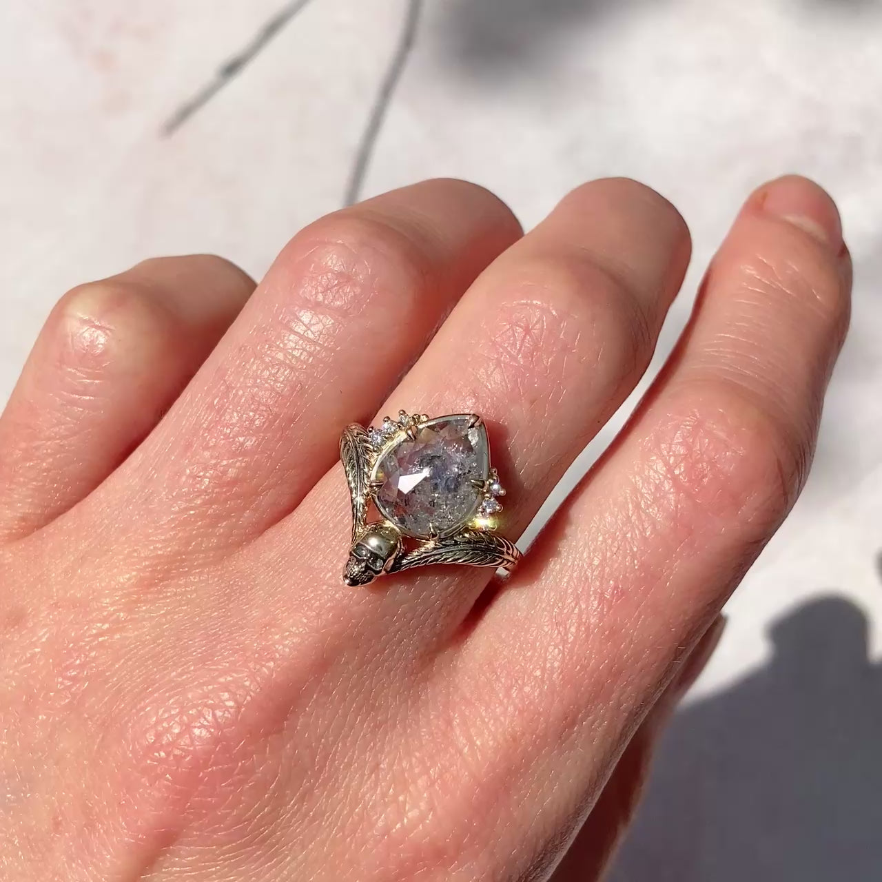 ::color_yellow ::| 2.61ctw pear rose cut salt and pepper diamond engagement ring with a skull and leaf motif and diamond accents yellow gold worn on finger video