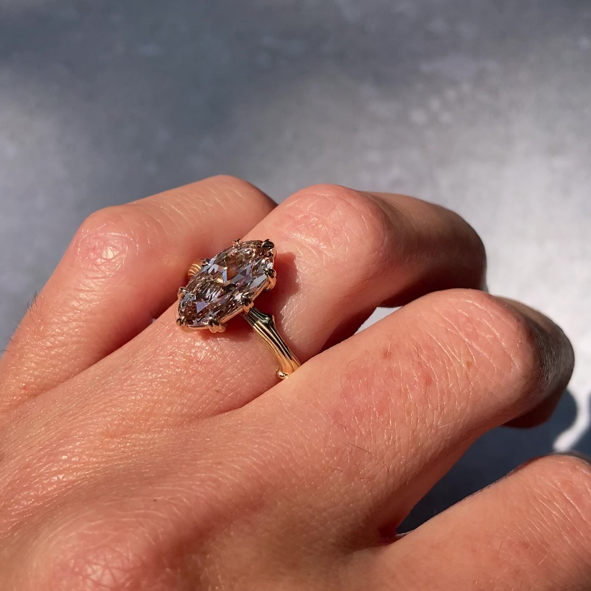 ::color_yellow ::| 2ct oval moval lab-grown diamond solitaire engagement ring with a twig band yellow gold worn on finger video