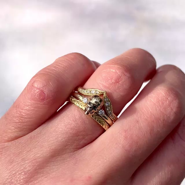::color_yellow ::|Persephone memento mori yellow gold skull ring with accent gems worn on finger stacked with other bands video