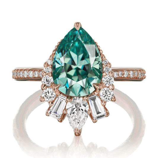 ::color_rose ::shank_halfway_three-quarters ::shank_three-quarters_halfway_no ::| 2.53ctw+ pear aqua-teal moissanite engagement ring with diamond accents Artemis rose gold diamond shank front view