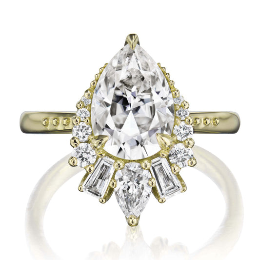 ::color_yellow ::shank_no ::shank_three-quarters_halfway_no ::| 2.53ctw+ pear moissanite engagement ring with diamond accents Artemis yellow gold front view