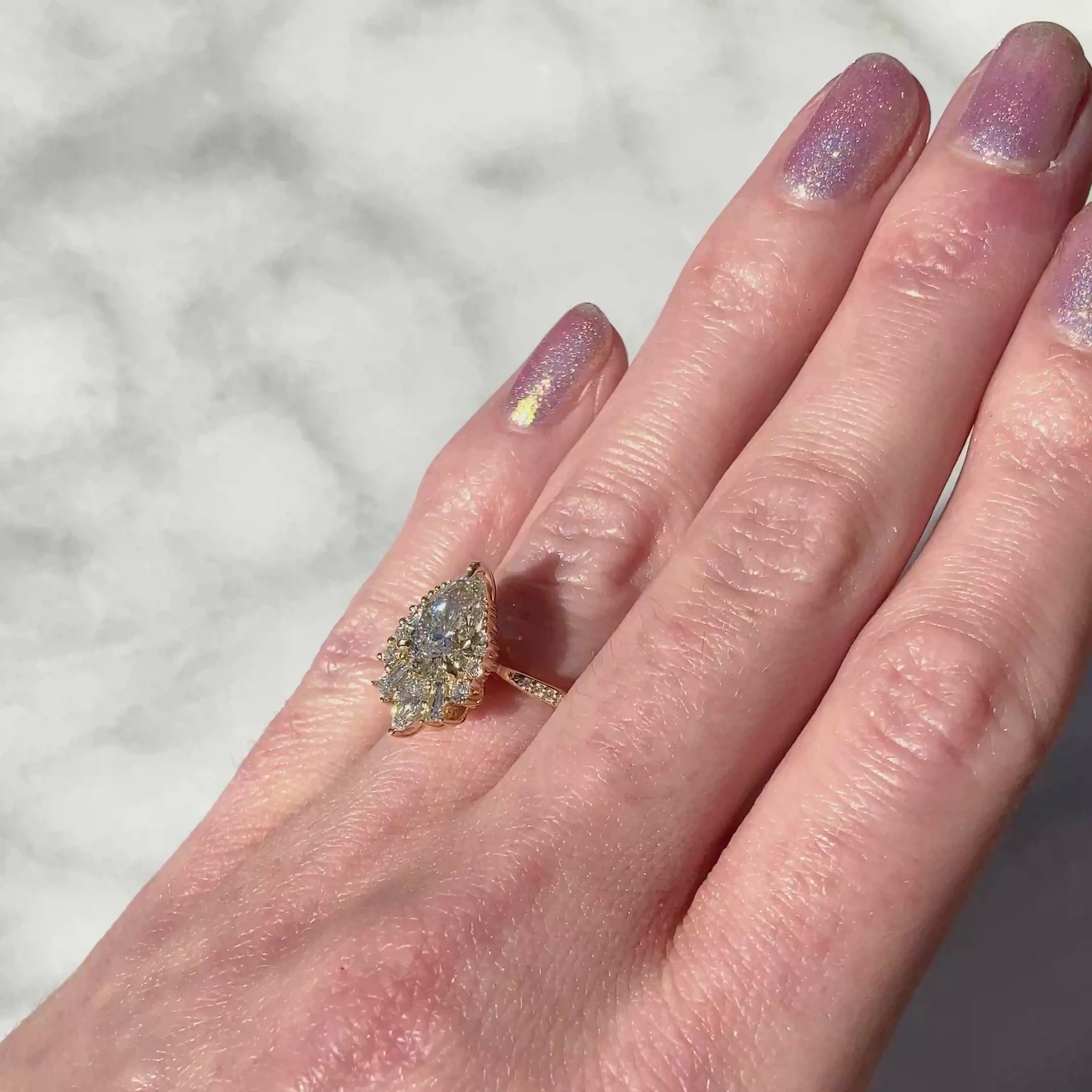 ::color_yellow ::shank_halfway_three-quarters ::shank_three-quarters_halfway_no ::| 1.5ctw+ pear lab-grown diamond engagement ring with diamond accents Artemis yellow gold diamond band video on finger