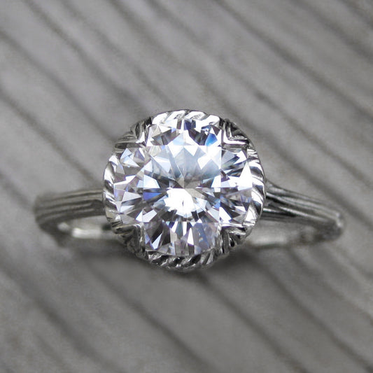 1.5ct white gold twig solitaire engagement ring with a Forever One Hearts & Arrows moissanite 