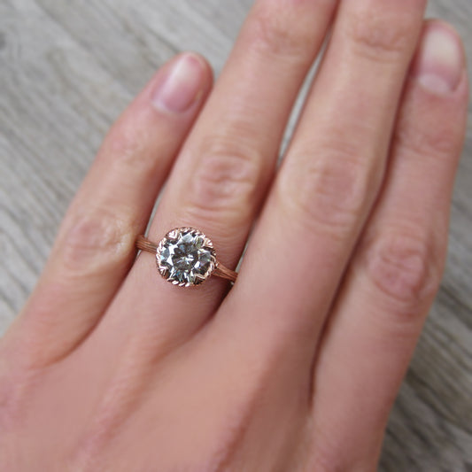 1.5ct rose gold twig solitaire engagement ring with a light grey moissanite 