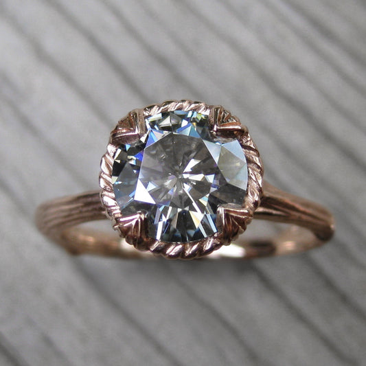 1.5ct rose gold twig solitaire engagement ring with a light grey moissanite 