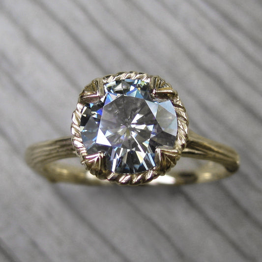 1.5ct yellow gold twig solitaire engagement ring with a light grey moissanite 