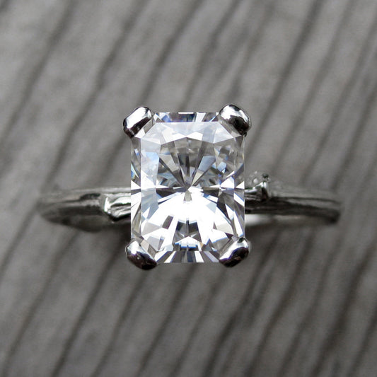 White gold twig solitaire engagement ring with a Forever One radiant cut moissanite 