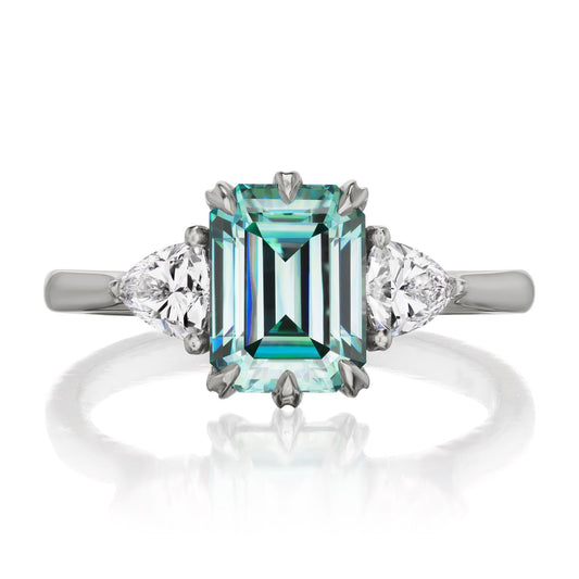 ::color_white ::| 2.17ctw emerald-cut aqua-teal moissanite three stone engagement ring Avery white gold trillion diamonds front view