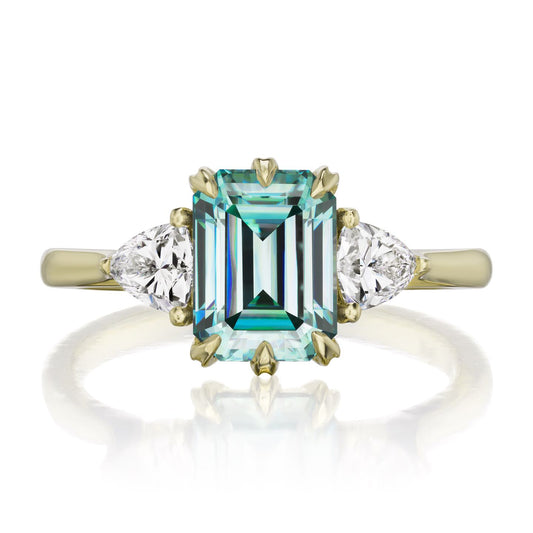 ::color_yellow ::| 2.17ctw emerald-cut aqua-teal moissanite three stone engagement ring Avery yellow gold trillion diamonds front view