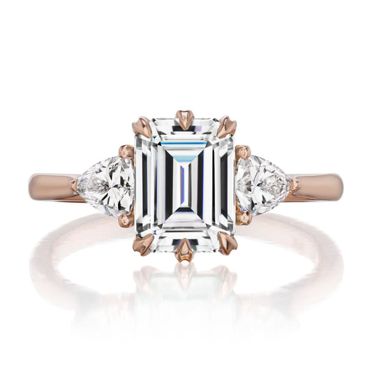 ::color_rose ::| 2.17ctw emerald cut moissanite three stone engagement ring Avery rose gold trillion diamonds front view