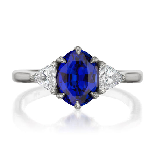 ::color_white ::| 2.17ctw oval blue sapphire three stone engagement ring Juno white gold trillion diamonds front view