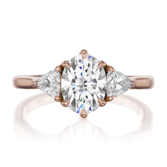 ::color_rose ::| 1.92ctw oval moissanite three stone engagement ring Juno rose gold trillion diamonds front view