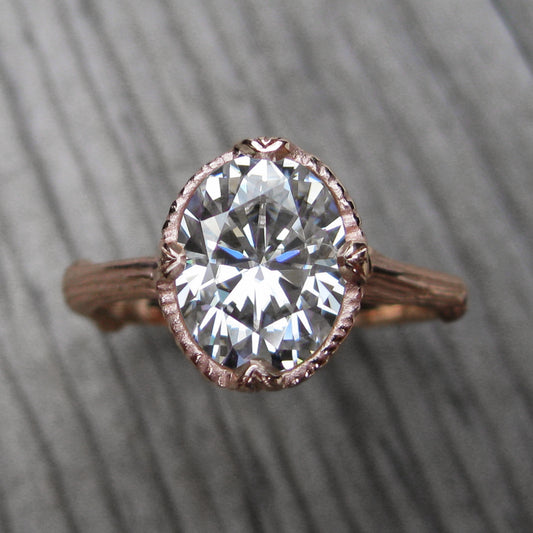 2ct rose gold twig solitaire engagement ring with a Forever One oval cut moissanite 