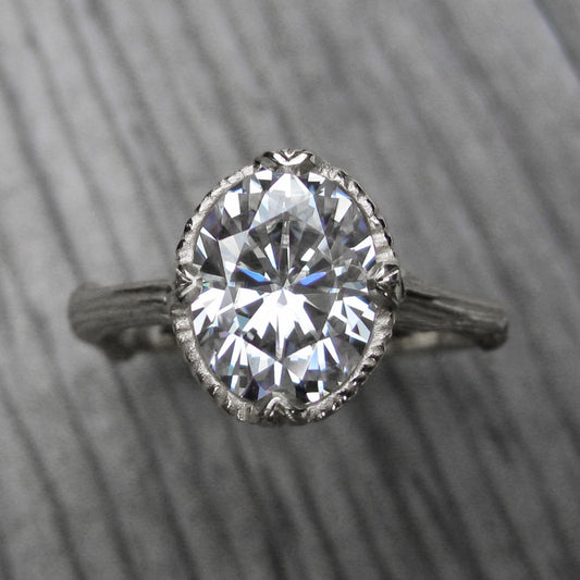 2ct white gold twig solitaire engagement ring with a Forever One oval cut moissanite 
