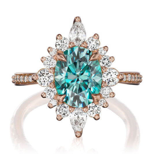 ::color_rose ::shank_halfway_three-quarters ::shank_three-quarters_halfway_no ::| 2.75ctw+ oval aqua-teal moissanite engagement ring Anika rose gold diamond shank front view