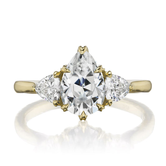 ::color_yellow ::| 1.92ctw pear moissanite three stone engagement ring Brynn yellow gold trillion diamonds front view